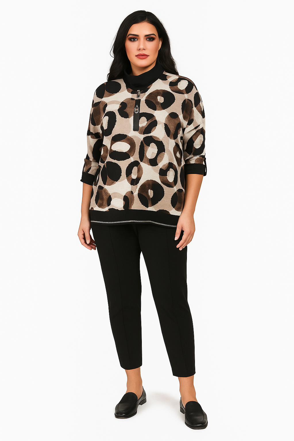 Woman wearing a leopard print sweater and black pants on a white background