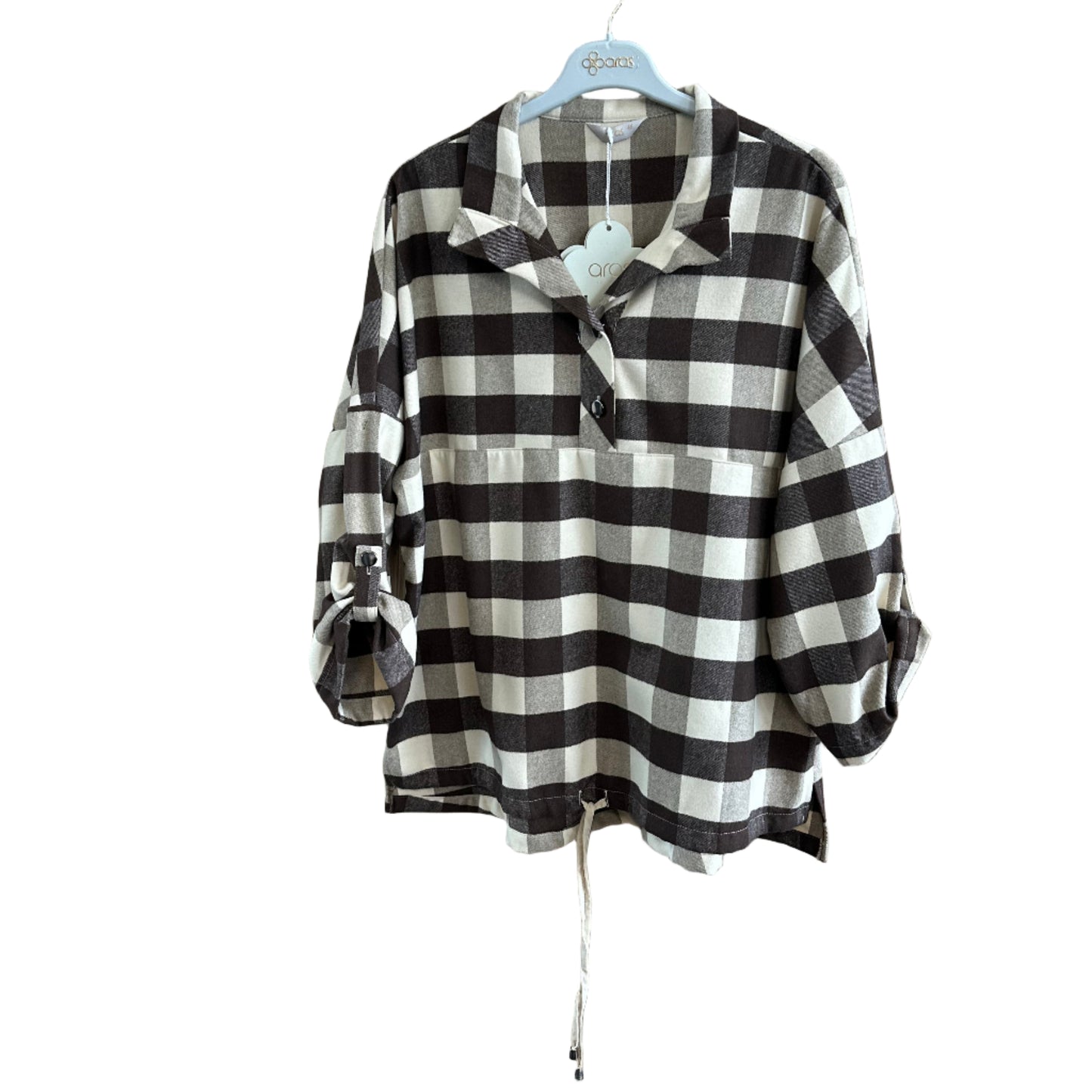 Black and white checkered shirt on a wooden surface