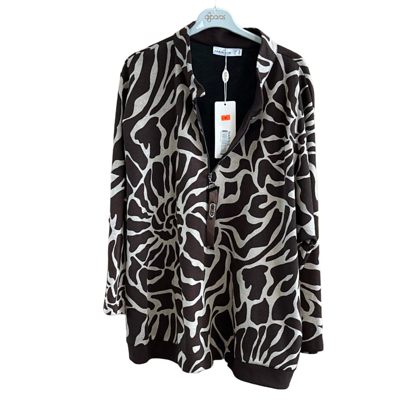 Zebra print jacket on a wooden board in a store setting