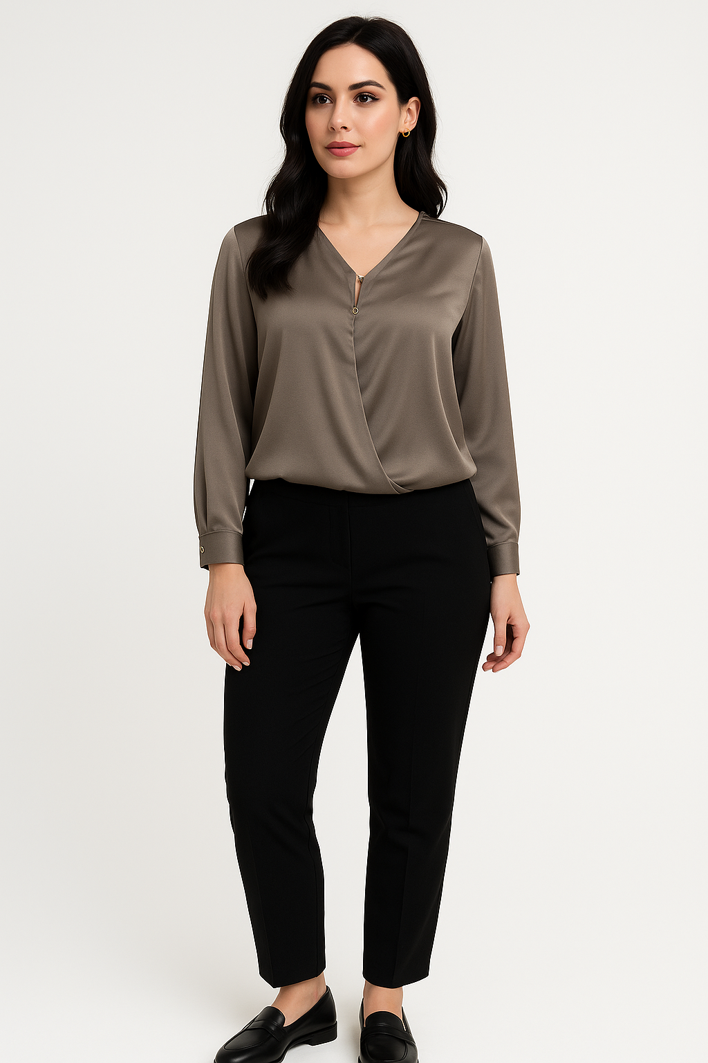 Woman wearing a brown blouse and black pants on a white background