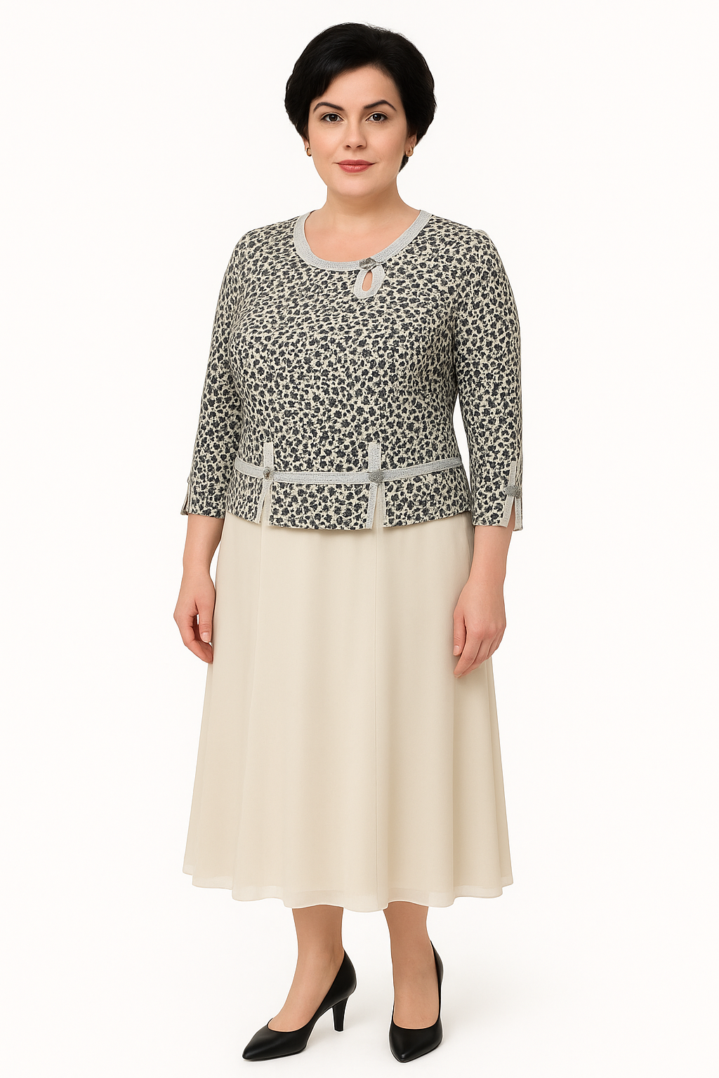 Woman wearing a patterned top and cream skirt on a white background