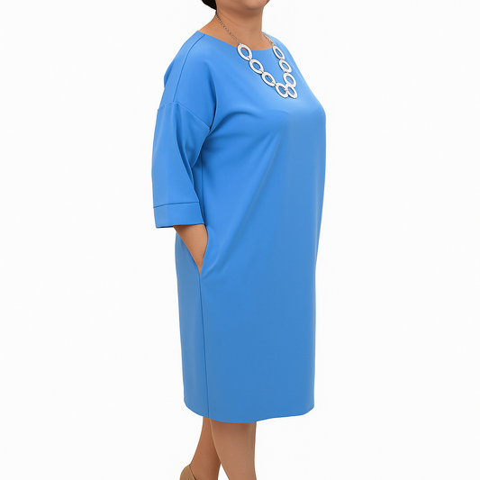 Blue dress worn by a person on a white background
