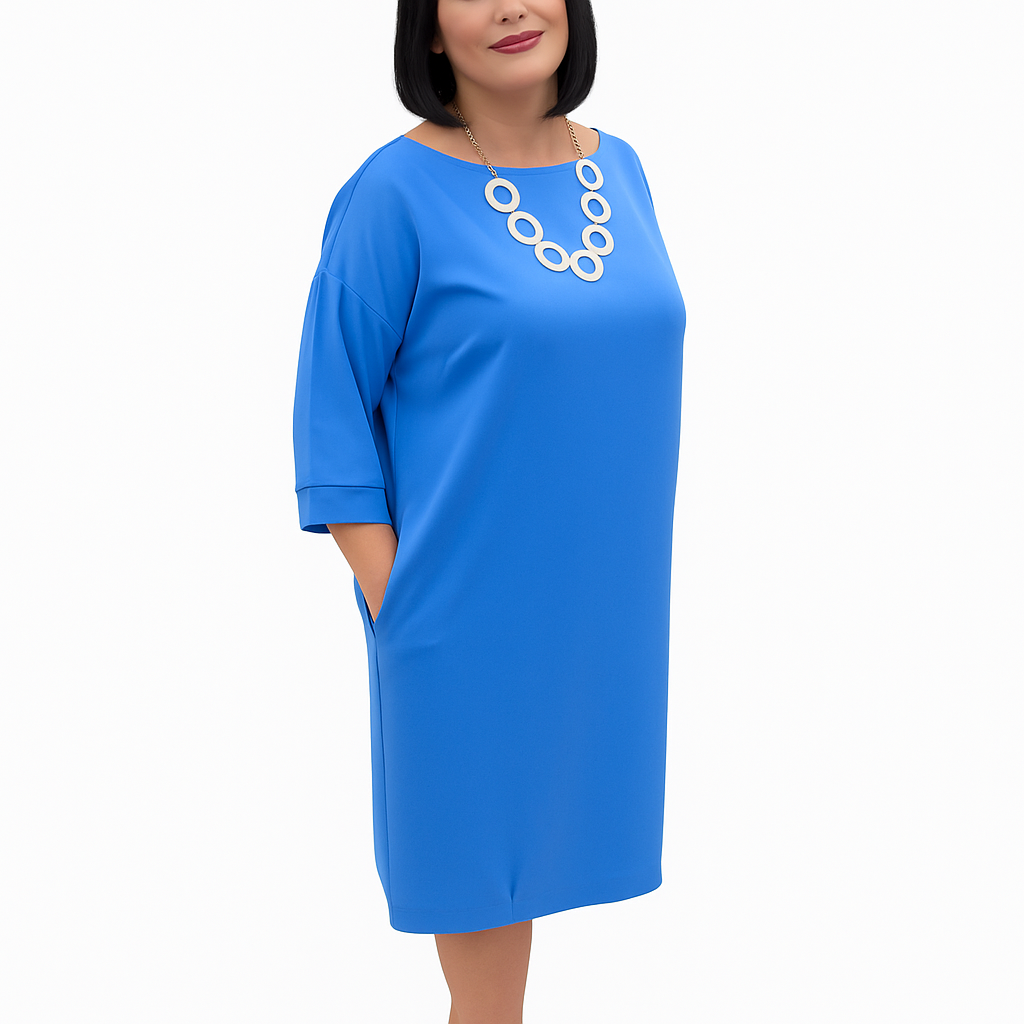 Woman wearing a blue dress with a white background