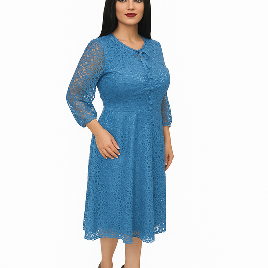Woman wearing a blue lace dress on a white background