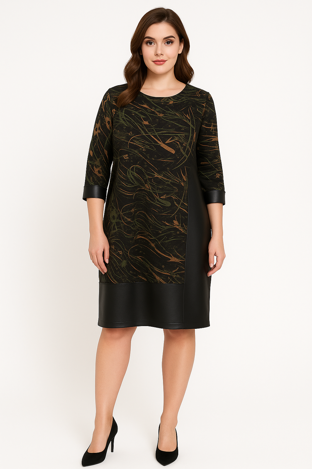 Woman wearing a black and gold patterned dress on a white background