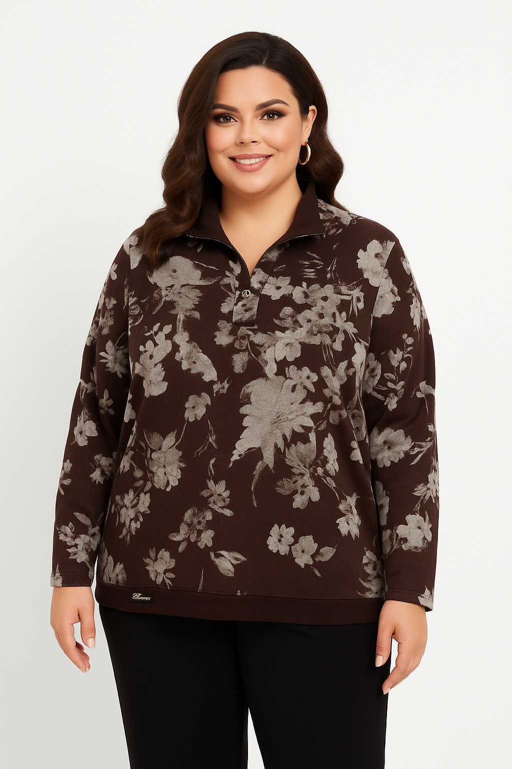 Woman wearing a brown floral-patterned sweater against a white background