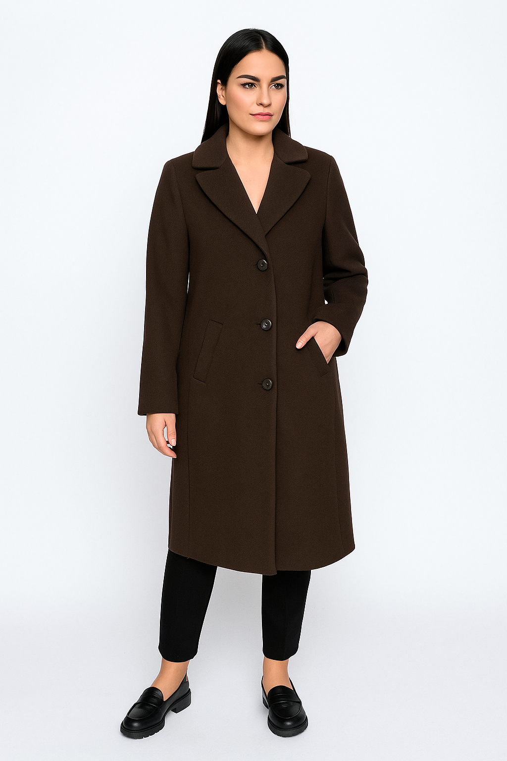 Woman wearing a brown coat on a white background