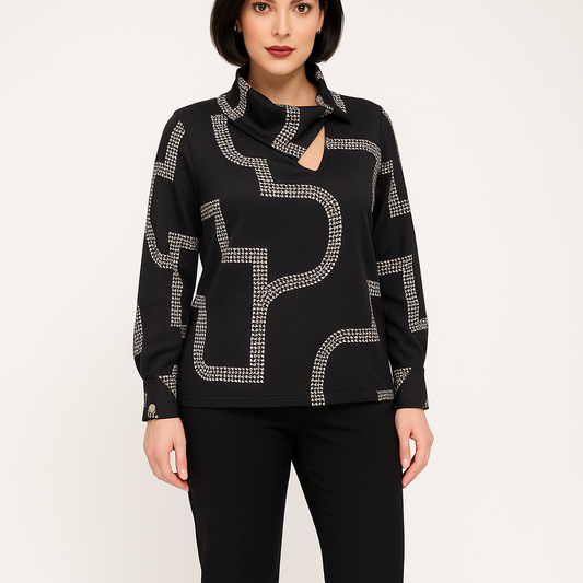 Black sweater with silver embellishments worn by a model on a white background