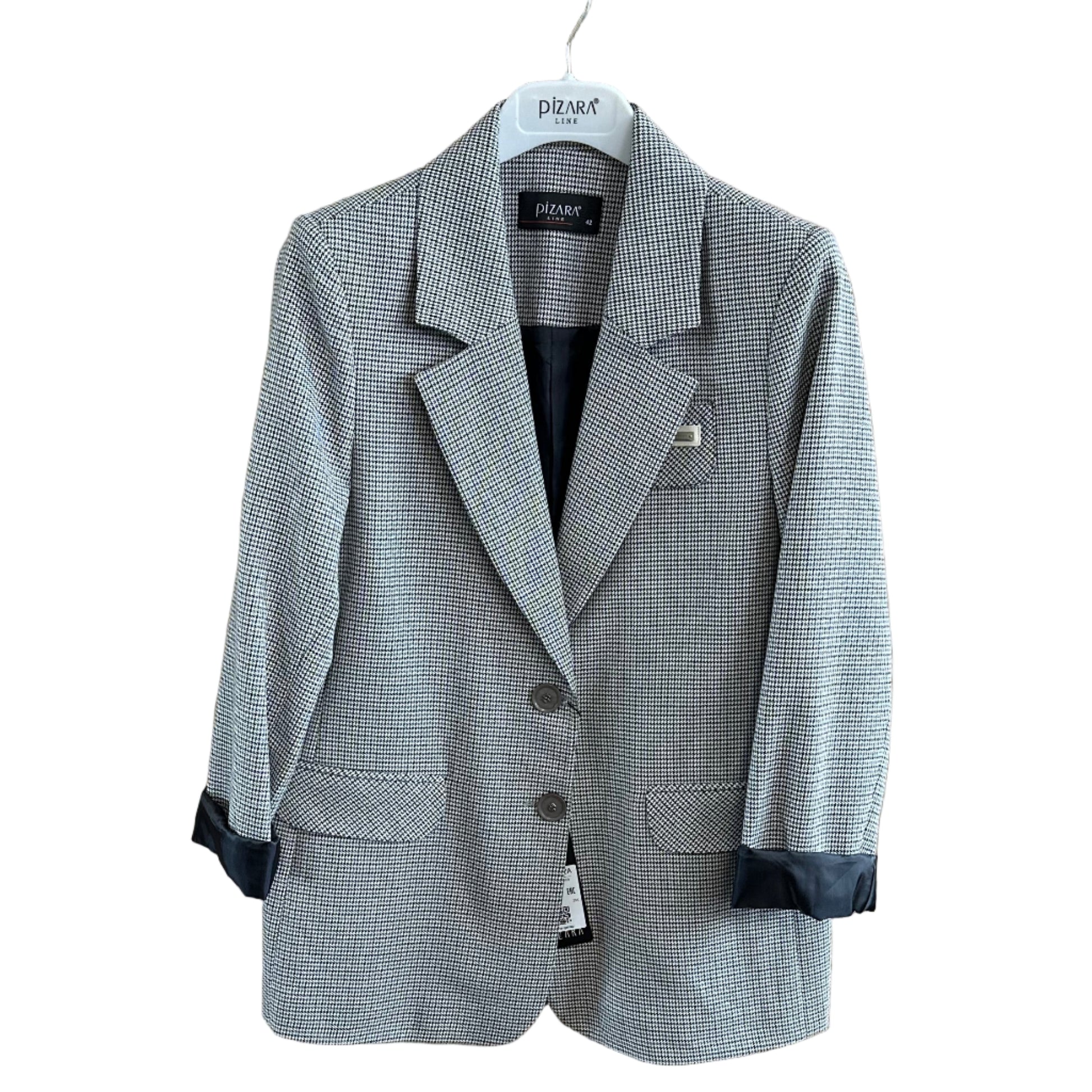 Gray suit jacket on a wooden surface