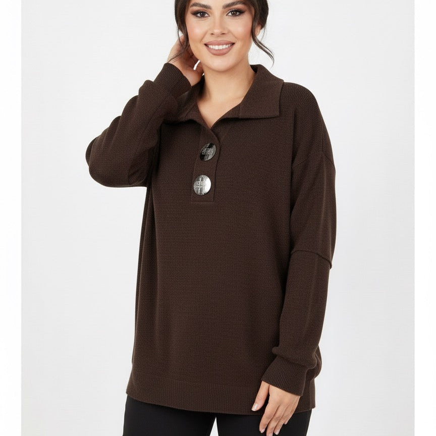 Woman wearing a brown long-sleeve top with a collar on a white background