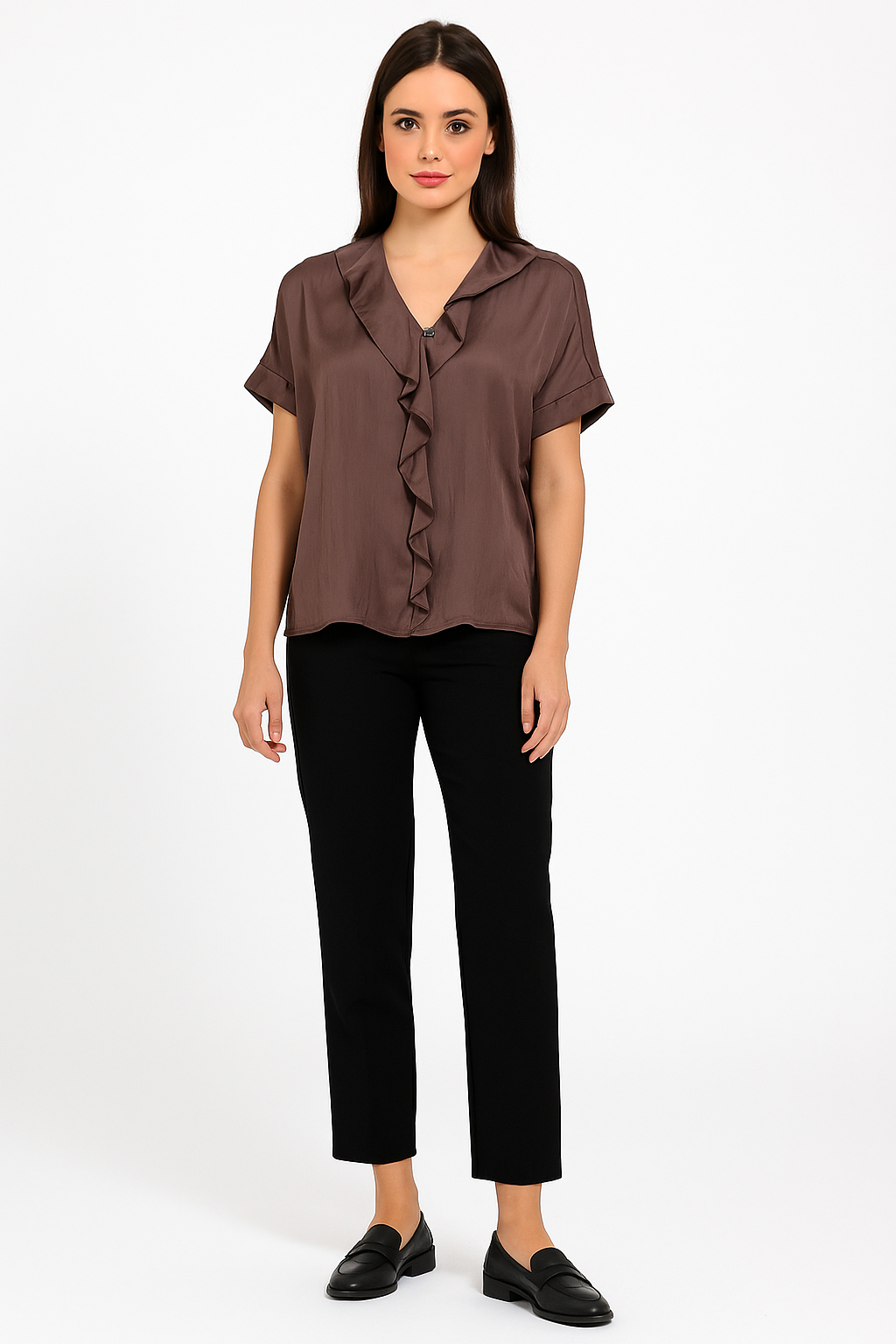 Woman wearing a brown blouse and black pants on a white background