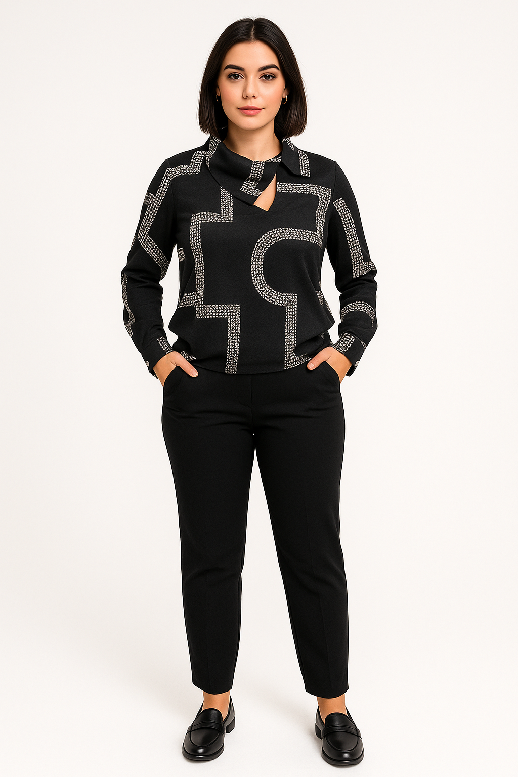 Woman wearing a black outfit with a patterned top on a white background