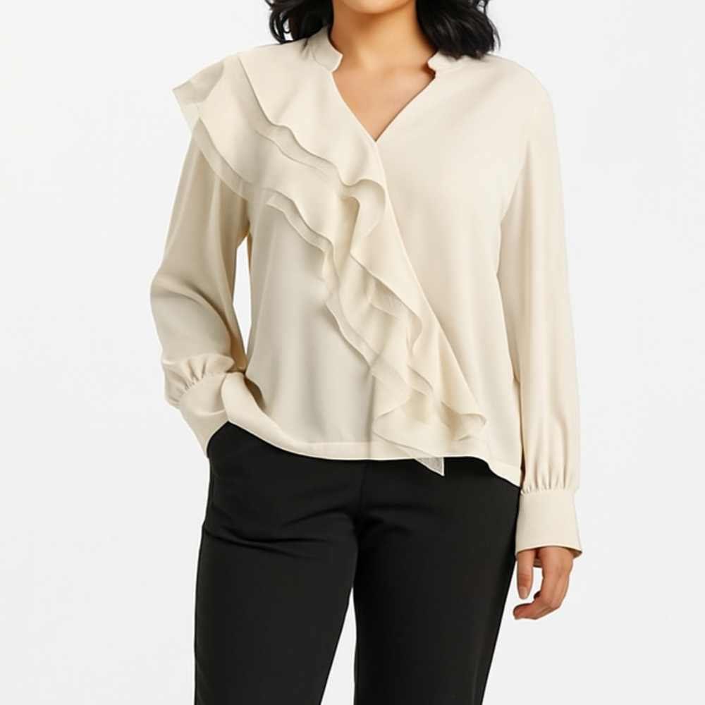 Kreminė palaidinė ilgomis rankovėmis su banguota puošnia kloste ir sagomis ant rankogalių