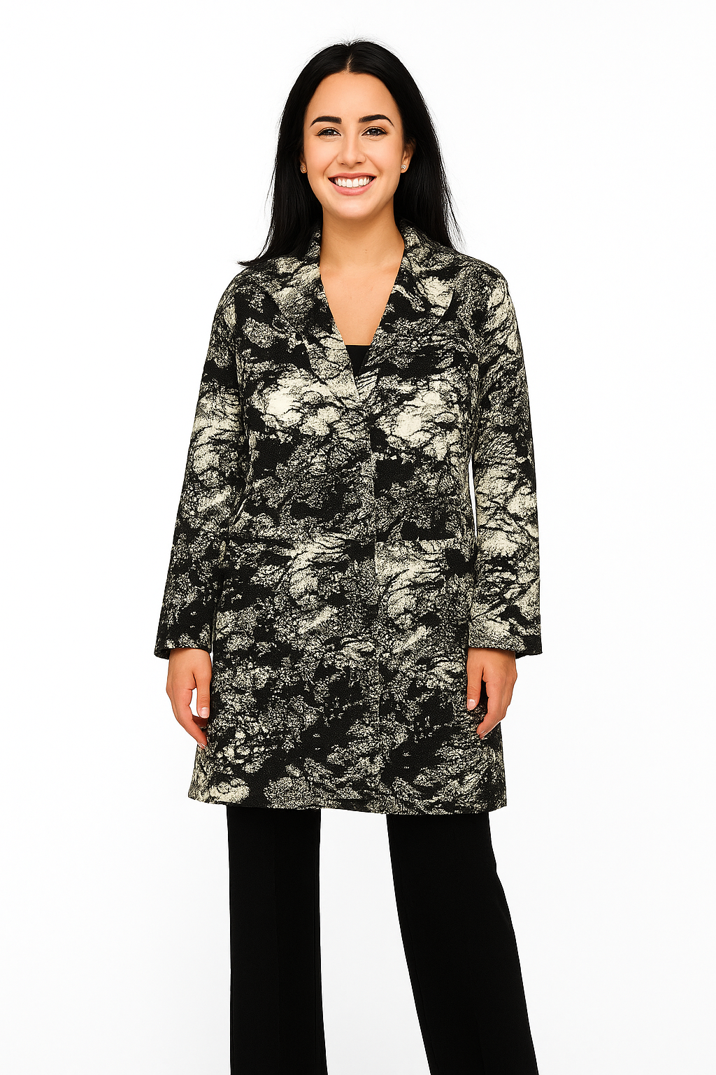 Woman wearing a black and white floral patterned coat on a white background
