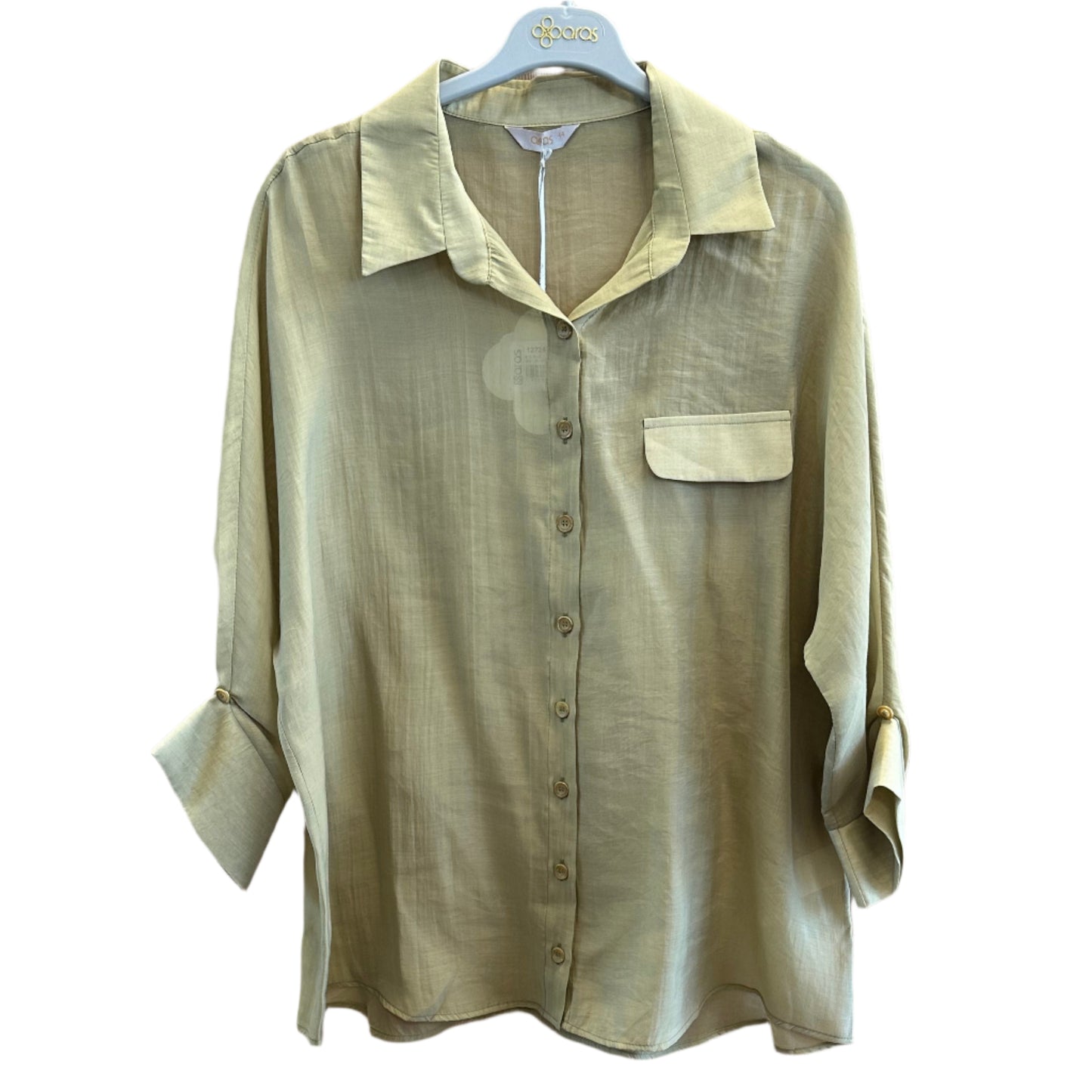 Elegantiška švelnios spalvos palaidinė ant pakabos