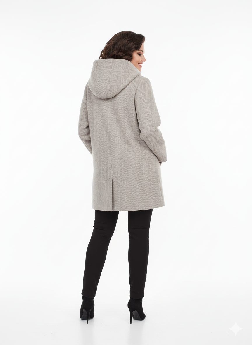 Woman wearing a light gray coat on a white background