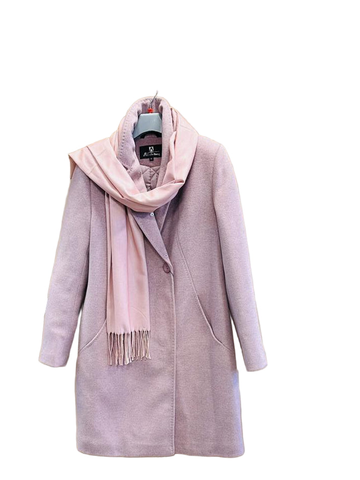 Pink coat with a scarf hanging on a wooden board in a clothing store.